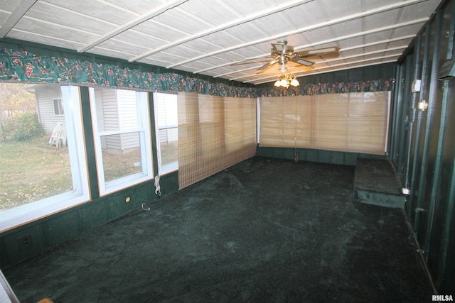 unfurnished sunroom featuring ceiling fan