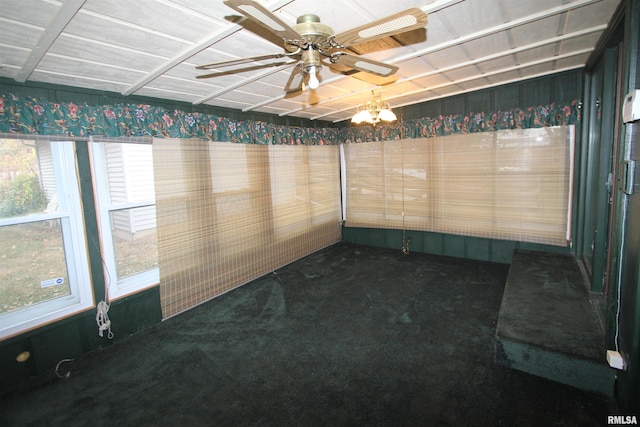 unfurnished sunroom with ceiling fan