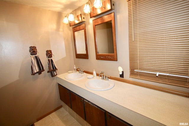 bathroom with tile patterned flooring and vanity