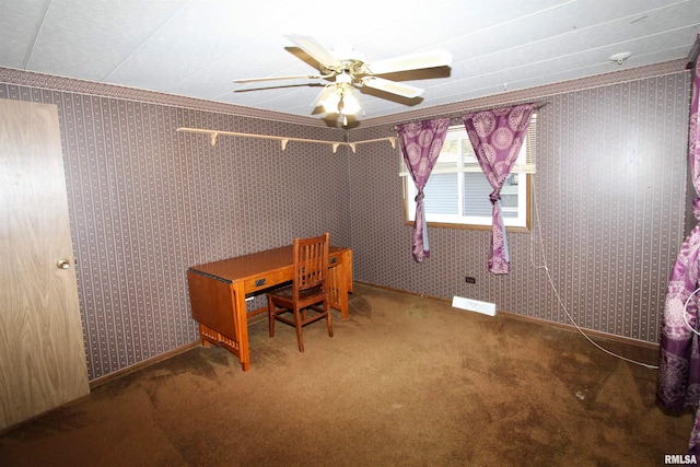 unfurnished office featuring ornamental molding, carpet floors, and ceiling fan