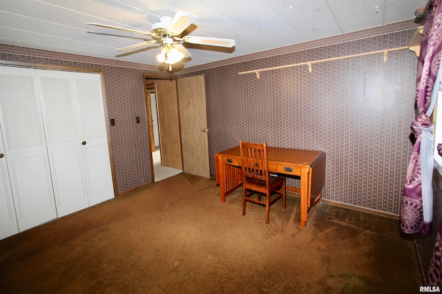 carpeted dining space featuring ceiling fan and ornamental molding