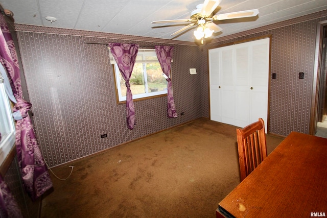 unfurnished bedroom with ornamental molding, carpet floors, and ceiling fan