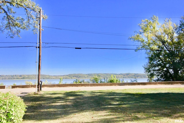 view of yard with a water and mountain view