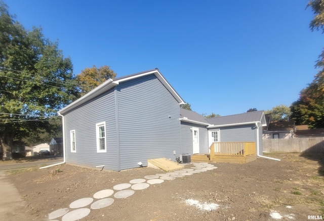 435 N Ave B Ave, Canton, IL 61520 - rear view of house with a deck, fence, and central AC