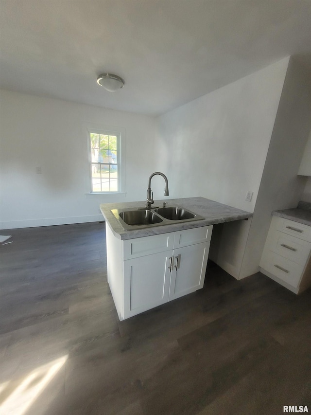435 N Ave B Ave, Canton, IL 61520 - kitchen with a sink, white cabinets, and dark wood-style flooring