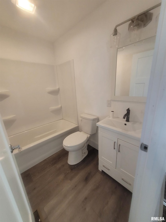 full bathroom featuring vanity, shower / washtub combination, toilet, and wood-type flooring