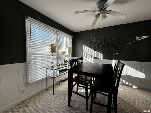 dining room with carpet and ceiling fan