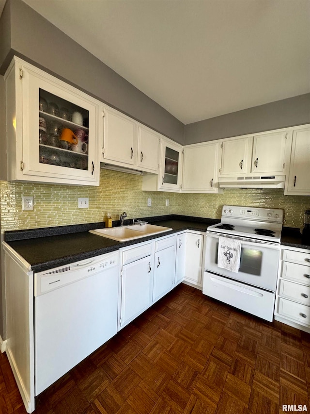 kitchen featuring decorative backsplash, white cabinets, sink, and white appliances