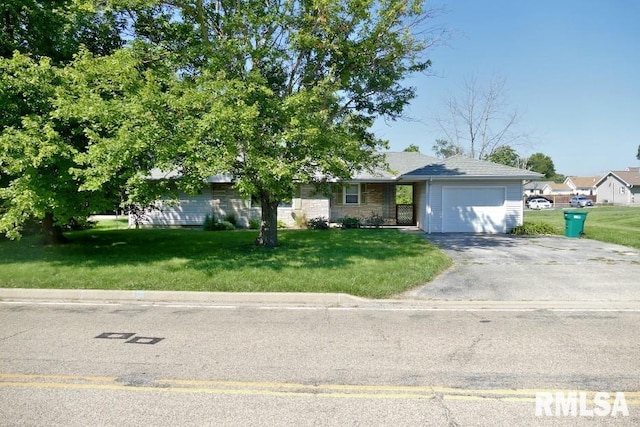 view of front of house with a front lawn and a garage