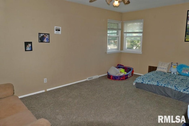 unfurnished bedroom featuring carpet floors and ceiling fan