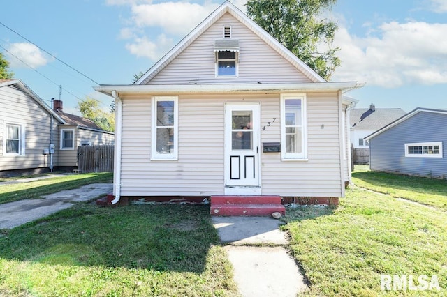 bungalow with a front lawn