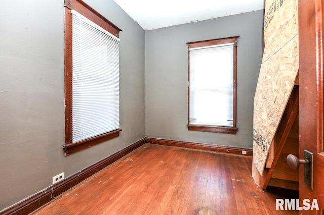 empty room featuring wood-type flooring