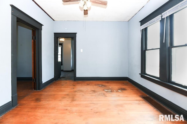 spare room featuring ceiling fan and wood-type flooring