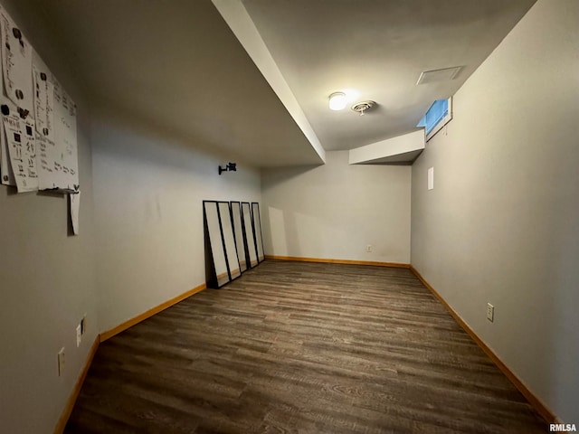 additional living space featuring dark hardwood / wood-style floors