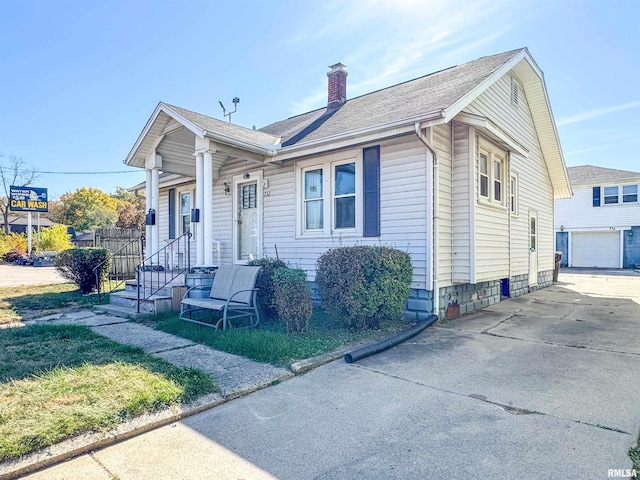 bungalow-style house featuring a garage