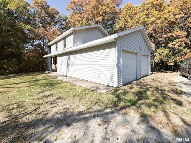 garage featuring a yard