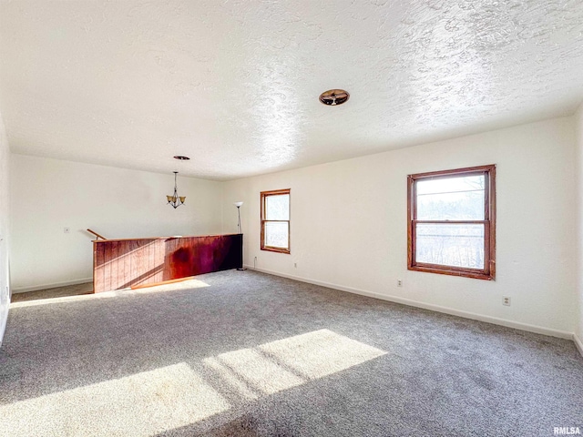 interior space featuring a notable chandelier and a textured ceiling