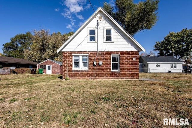 rear view of house with a yard