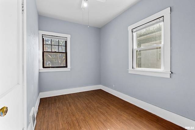 empty room featuring hardwood / wood-style flooring and ceiling fan