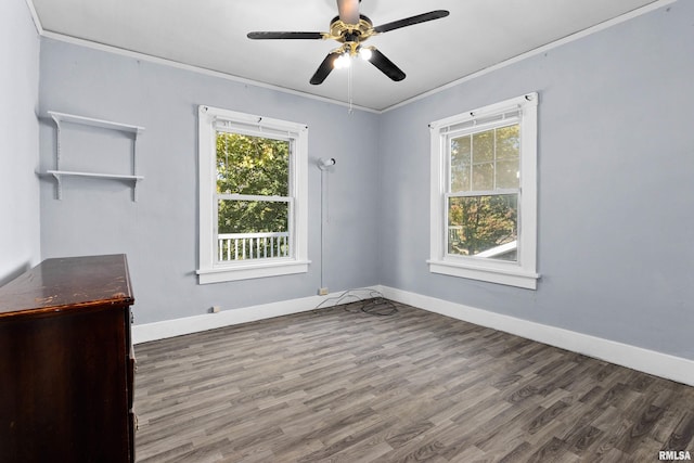 spare room featuring crown molding, hardwood / wood-style flooring, and ceiling fan