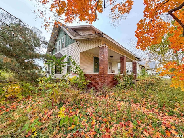 view of home's exterior with covered porch