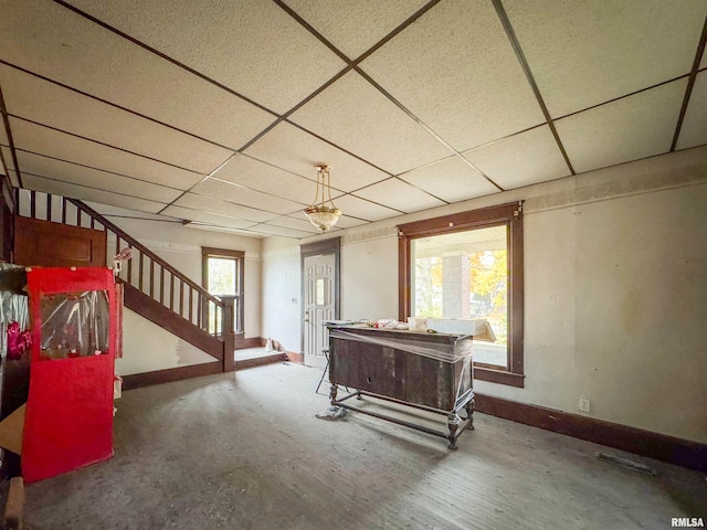 game room with a drop ceiling