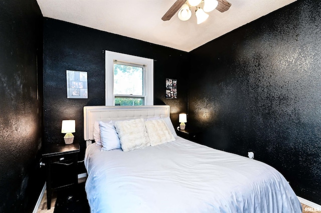 bedroom featuring ceiling fan and lofted ceiling