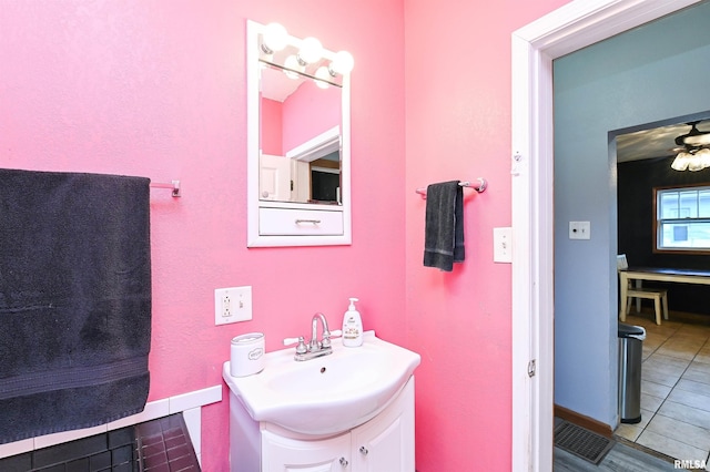 bathroom with vanity, tile patterned flooring, and ceiling fan