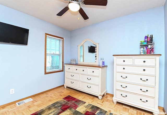 bedroom with light parquet flooring and ceiling fan