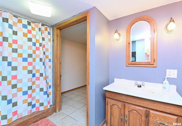 bathroom with vanity and tile patterned flooring