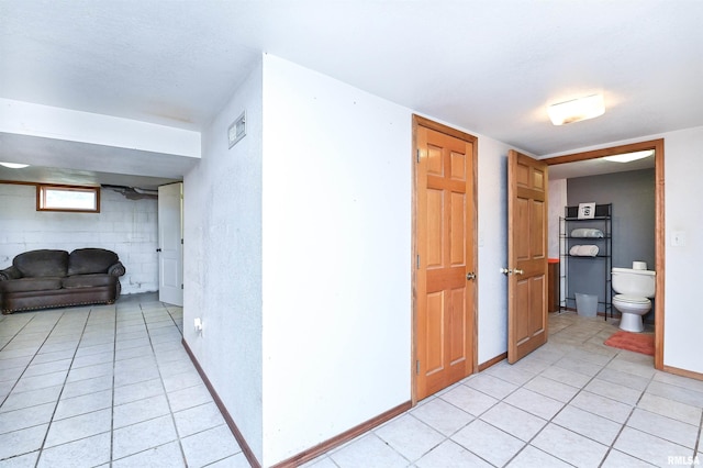 hall with light tile patterned flooring