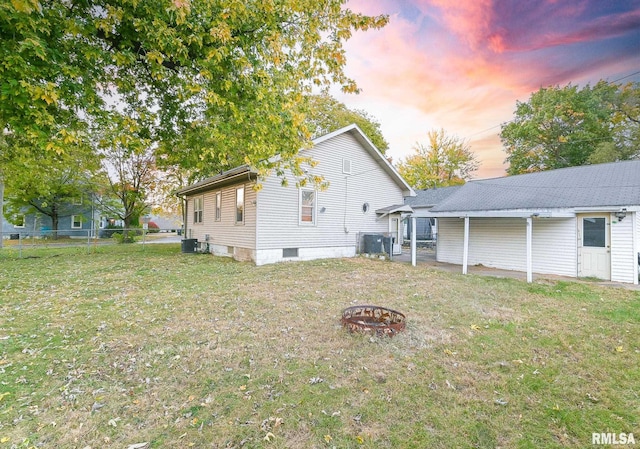 exterior space with a yard and cooling unit