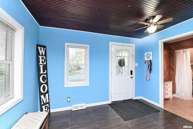 entrance foyer featuring ceiling fan, dark parquet floors, and wood ceiling