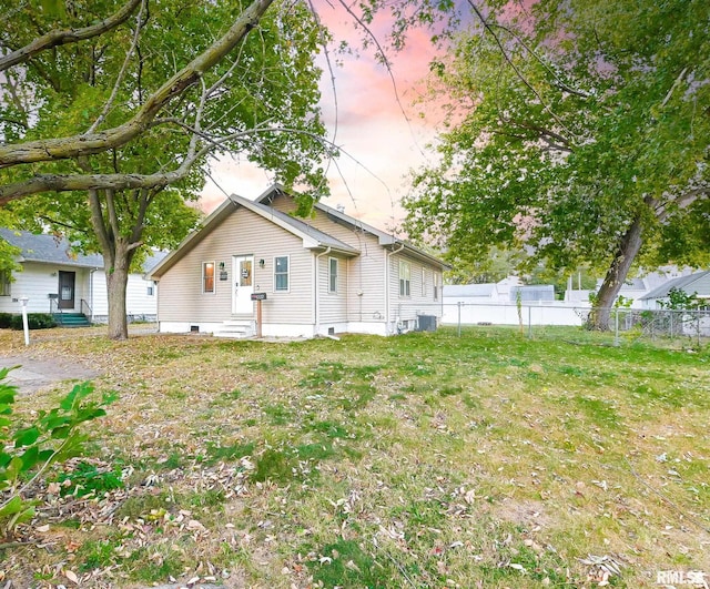 exterior space featuring a yard and cooling unit