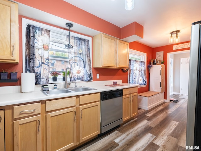 kitchen with dishwasher, sink, light brown cabinetry, and dark hardwood / wood-style floors