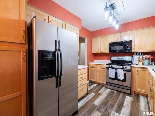 kitchen with appliances with stainless steel finishes, dark hardwood / wood-style floors, and light brown cabinetry