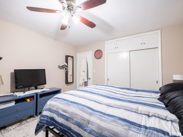 bedroom with light colored carpet, a closet, and ceiling fan