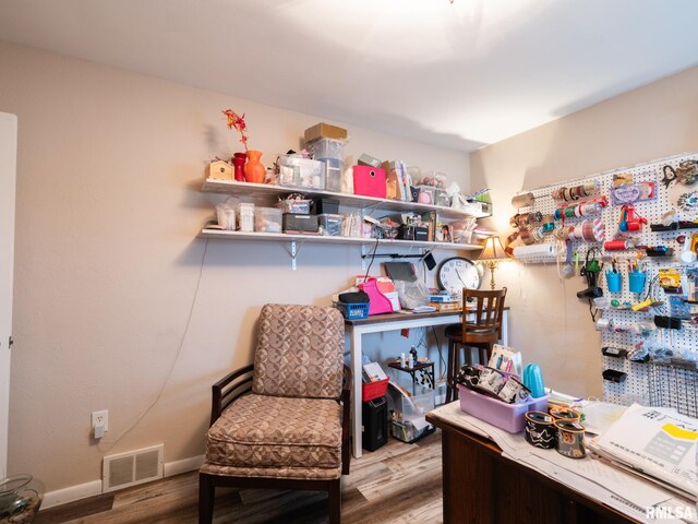 office space with light hardwood / wood-style flooring