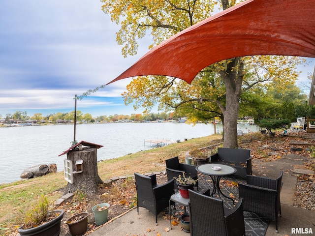 view of patio featuring a water view