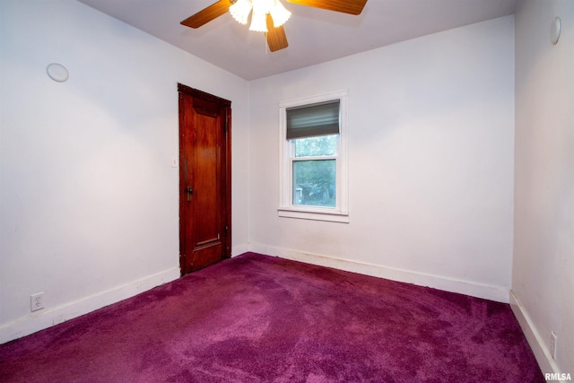 empty room with carpet flooring and ceiling fan