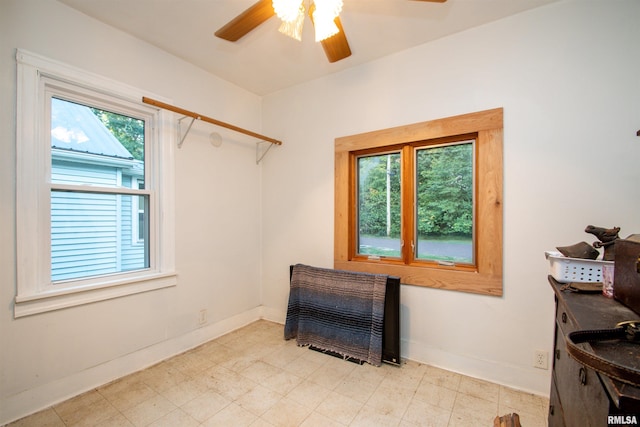 sitting room featuring ceiling fan