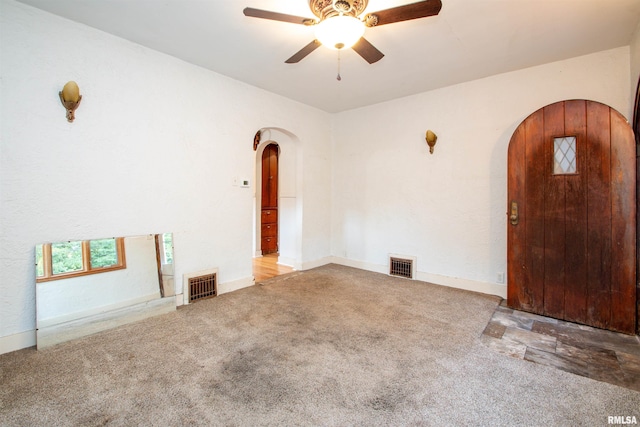 carpeted empty room with ceiling fan