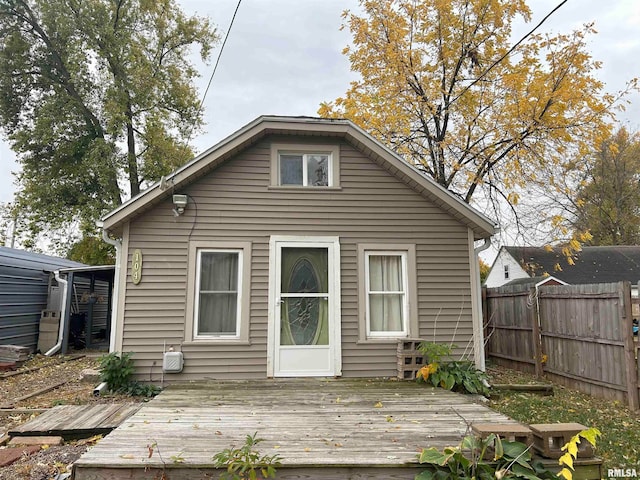 rear view of house featuring a deck