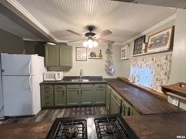 kitchen featuring white appliances, crown molding, sink, and ceiling fan