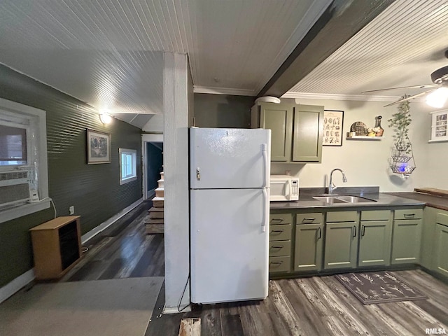 kitchen featuring dark hardwood / wood-style flooring, sink, crown molding, green cabinetry, and white appliances