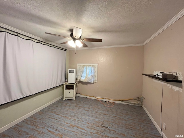 unfurnished bedroom with ceiling fan, hardwood / wood-style flooring, a textured ceiling, and crown molding