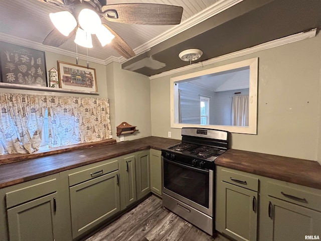 kitchen with wooden counters, ornamental molding, stainless steel gas range oven, and dark hardwood / wood-style floors