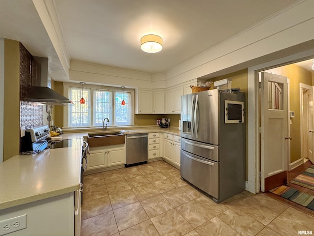 kitchen with extractor fan, stainless steel appliances, ornamental molding, sink, and white cabinets