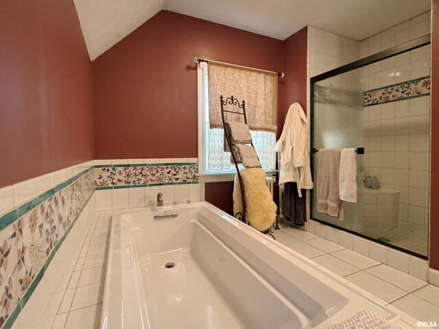 bathroom featuring plus walk in shower and vaulted ceiling