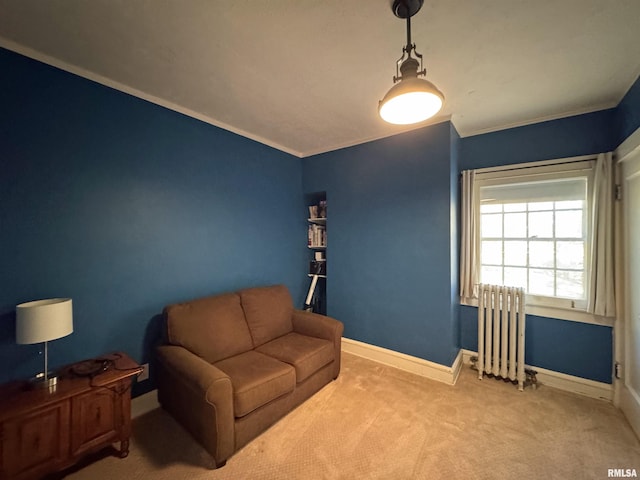 living area with carpet, crown molding, and radiator